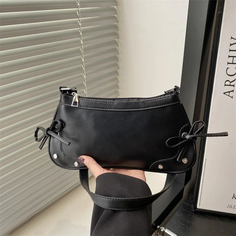 Trendy retro double bow shoulder bag for women featuring a sleek and minimalist underarm silhouette — view 2