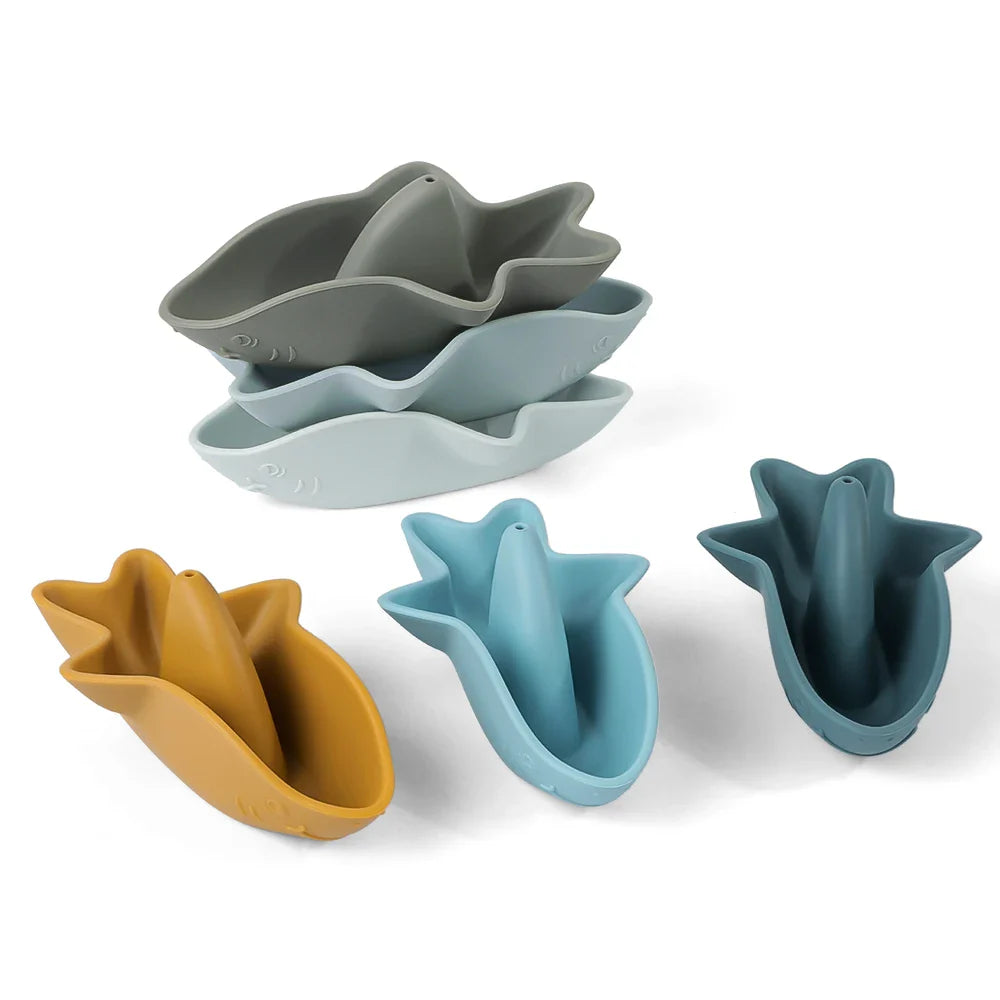 Silicone shark bath toy set of three in soft oceanic colors stacked for compact storage — view 2