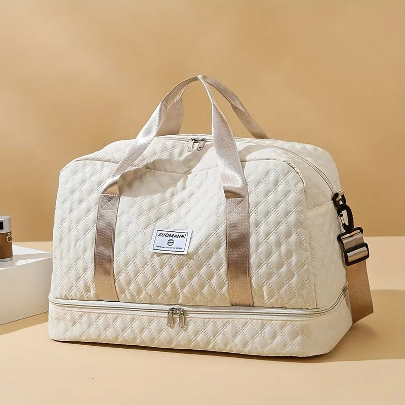 Large beige nylon travel duffel bag with handles and zipper closures for weekend trips — view 2