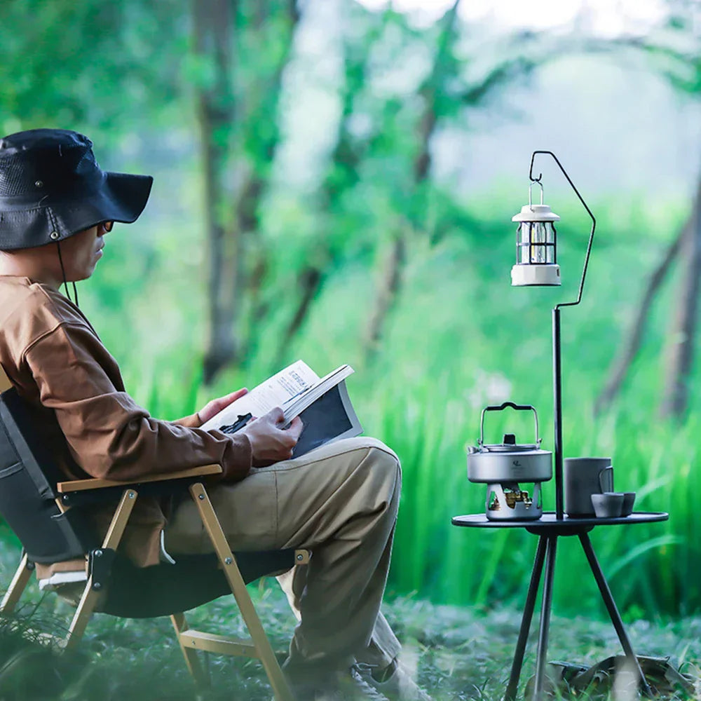 Portable telescopic camping table with round top, adjustable aluminum legs, and outdoor lamp holder. — view 4