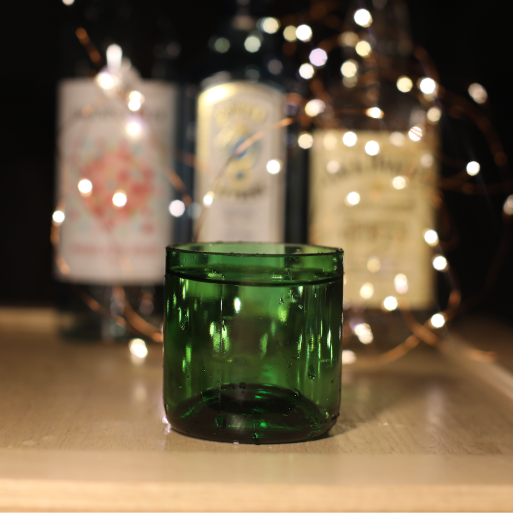 Green eco-friendly holiday gift set with upcycled wine glasses, glass platter, and spruce scented candle — view 4