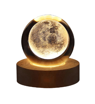 3D laser engraved galaxy crystal ball glowing on a warm LED illuminated wooden base