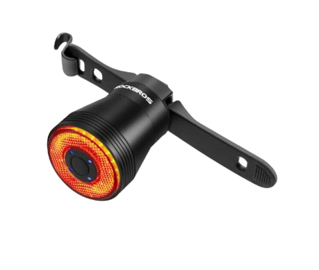 Smart LED bike taillight in black aluminum with glowing red COB light mounted on seat rail