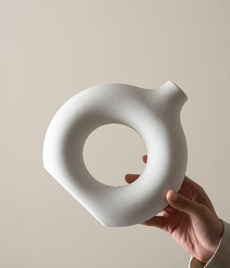 Modern Nordic circle ceramic vase in matte white, minimalist hollow sculptural decor for dried flowers — view 5