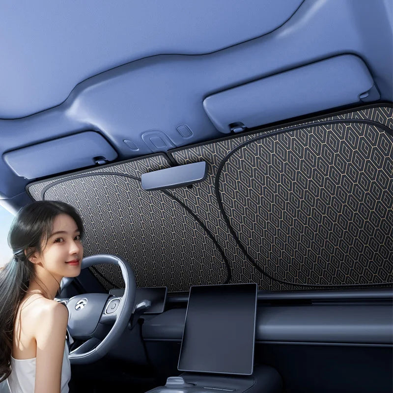 Foldable car windshield sun shade in black showing universal fit UV protection for vehicle interiors — view 2