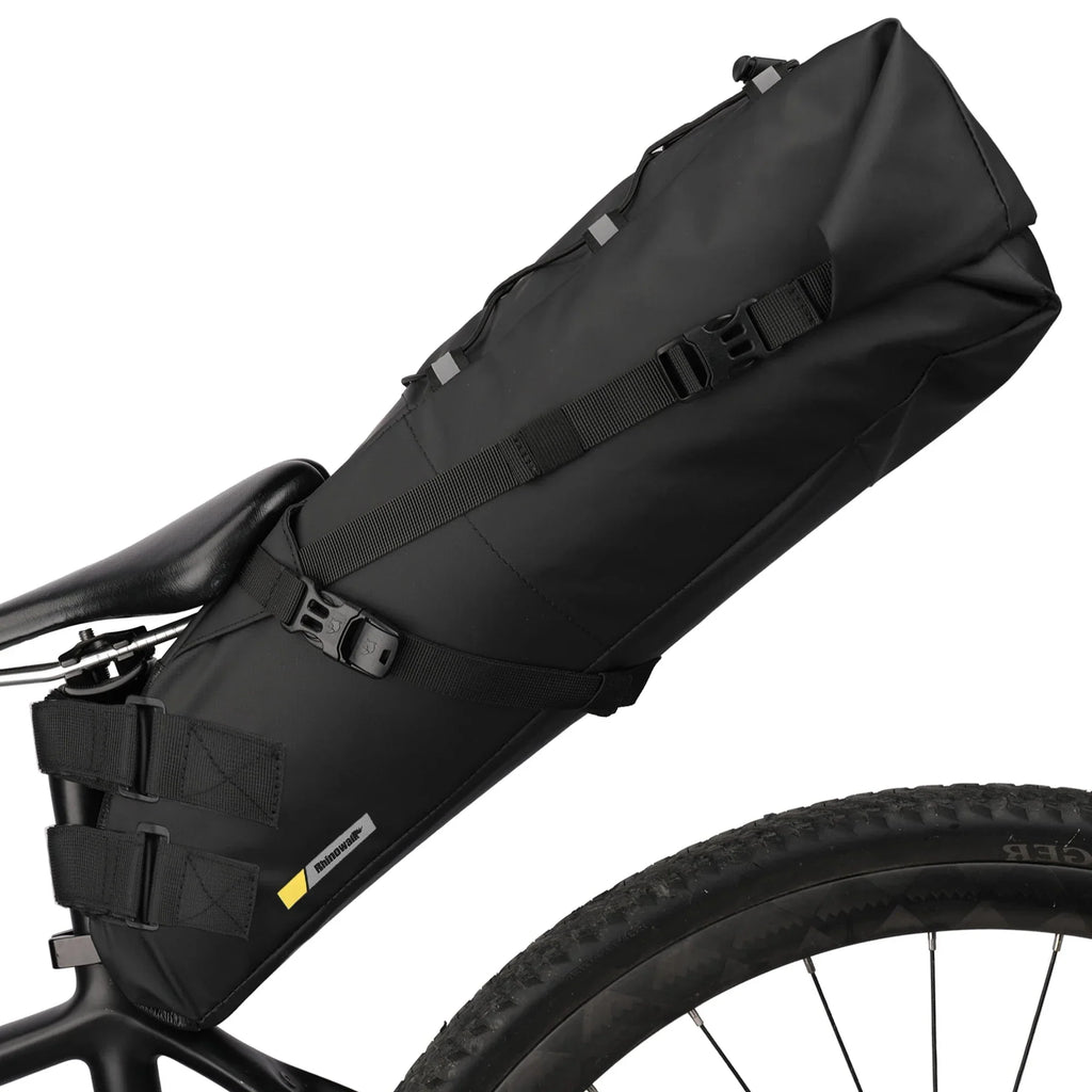 Black 10L waterproof bike saddle bag attached to a bicycle seatpost for rear storage