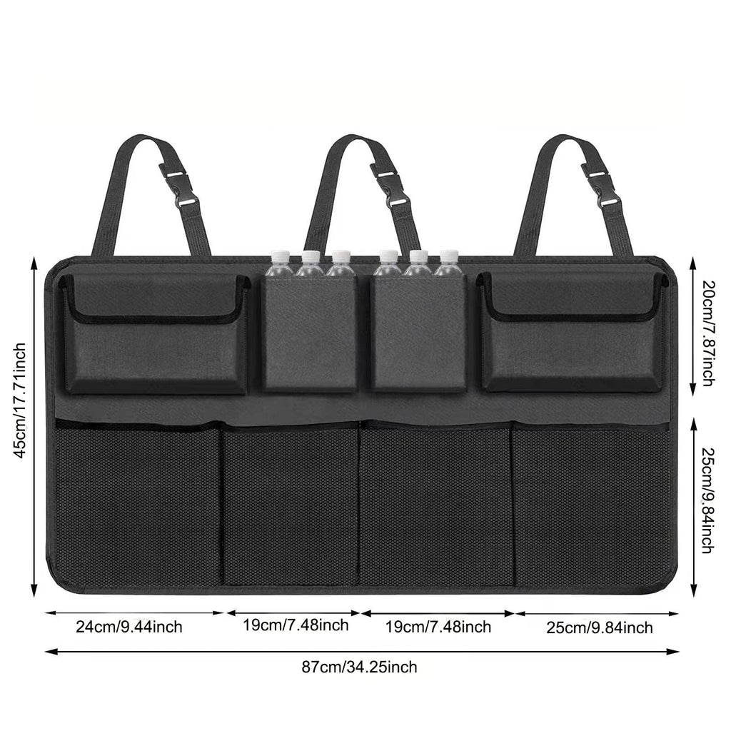 Black hanging car trunk organizer with 8 large storage pockets attached to vehicle backseat headrests — view 3