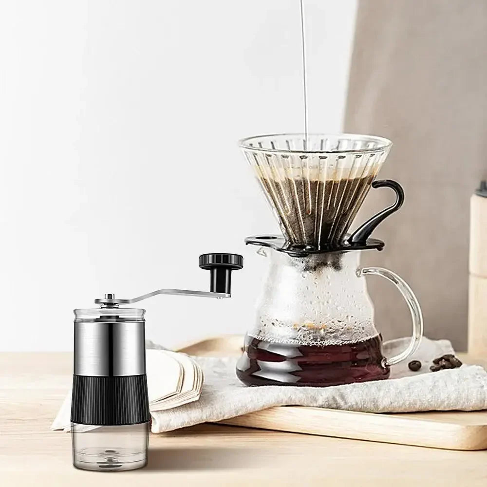Black manual coffee grinder with hand crank, adjustable ceramic burr, and silicone base — view 3