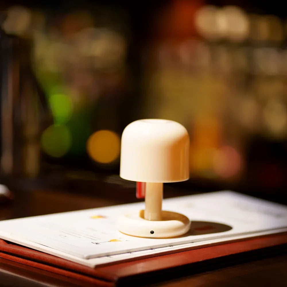 Compact LED mini sunset night light projecting a warm golden glow onto a blank wall — view 4