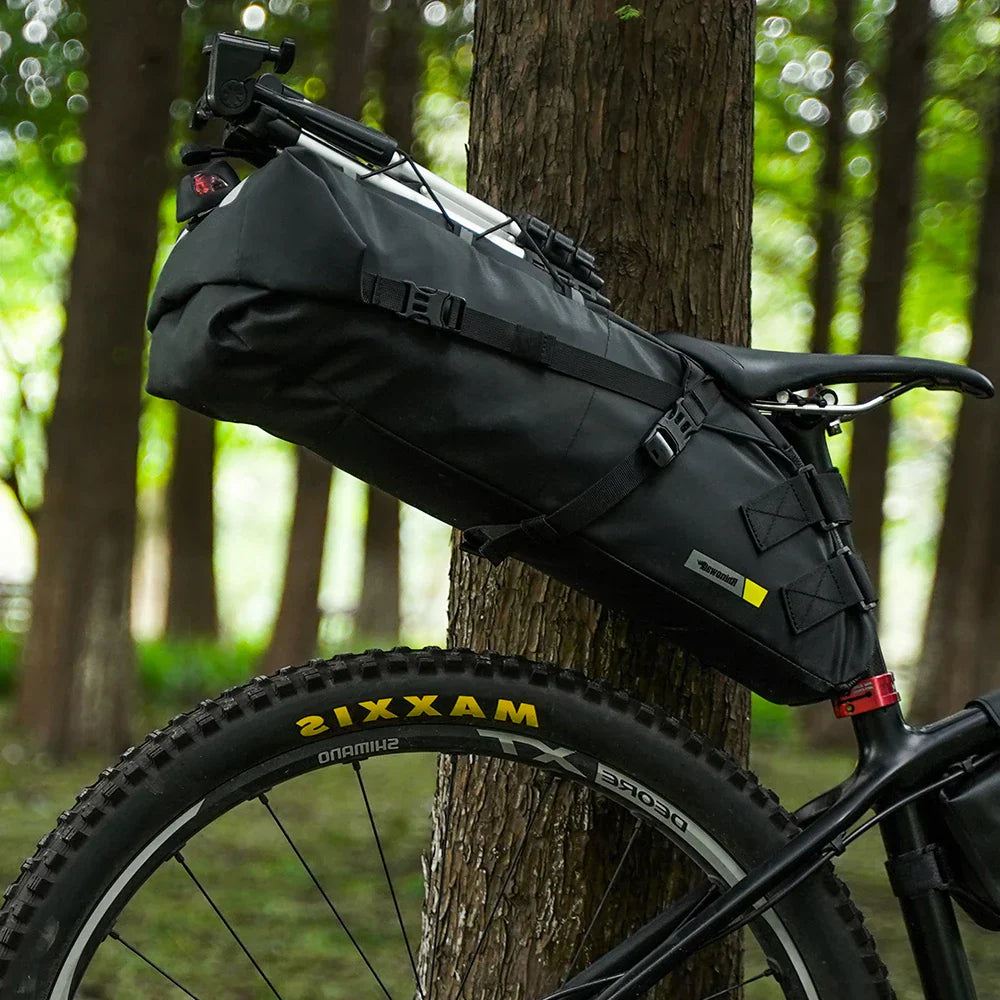 Black 10L waterproof bike saddle bag attached to a bicycle seatpost for rear storage — view 3