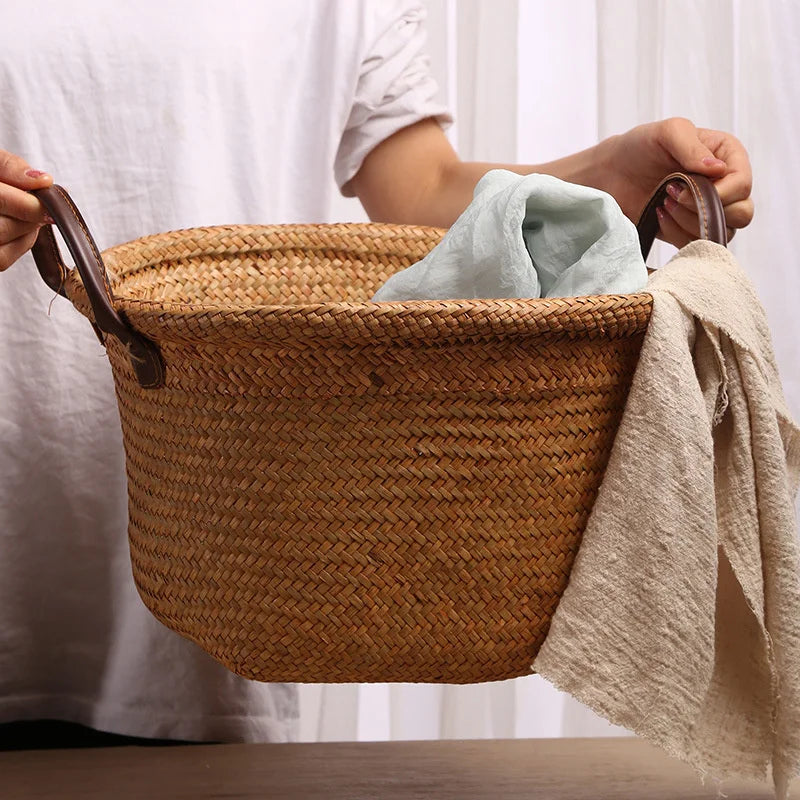 Foldable seagrass wicker basket with natural woven texture and elegant brown leather carrying handles — view 2