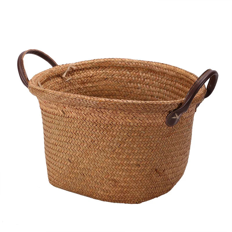 Foldable seagrass wicker basket with natural woven texture and elegant brown leather carrying handles