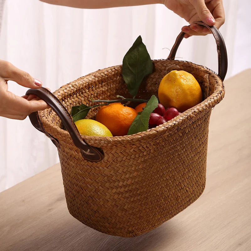 Foldable seagrass wicker basket with natural woven texture and elegant brown leather carrying handles — view 3