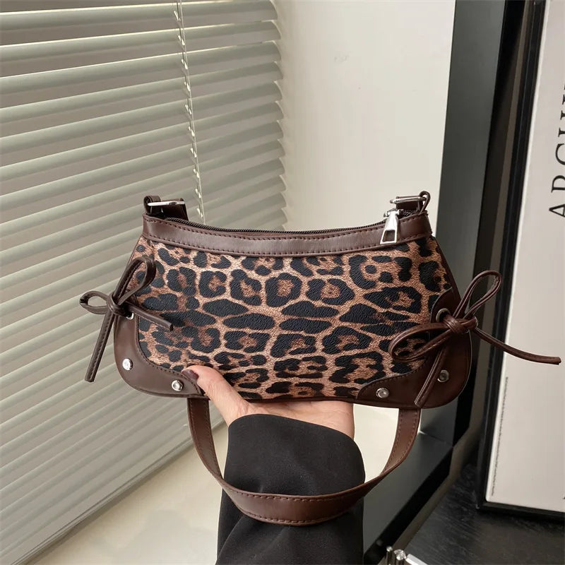 Trendy retro double bow shoulder bag for women featuring a sleek and minimalist underarm silhouette — view 4