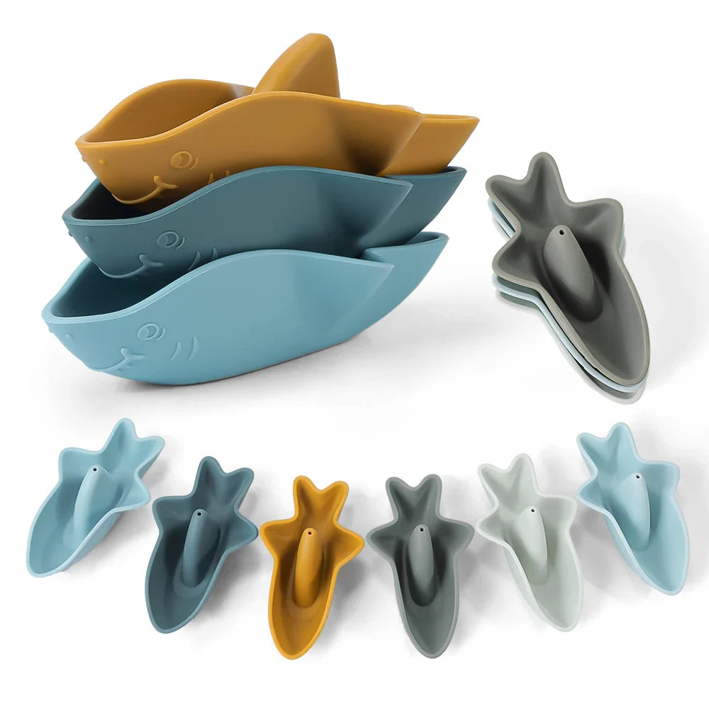 Silicone shark bath toy set of three in soft oceanic colors stacked for compact storage