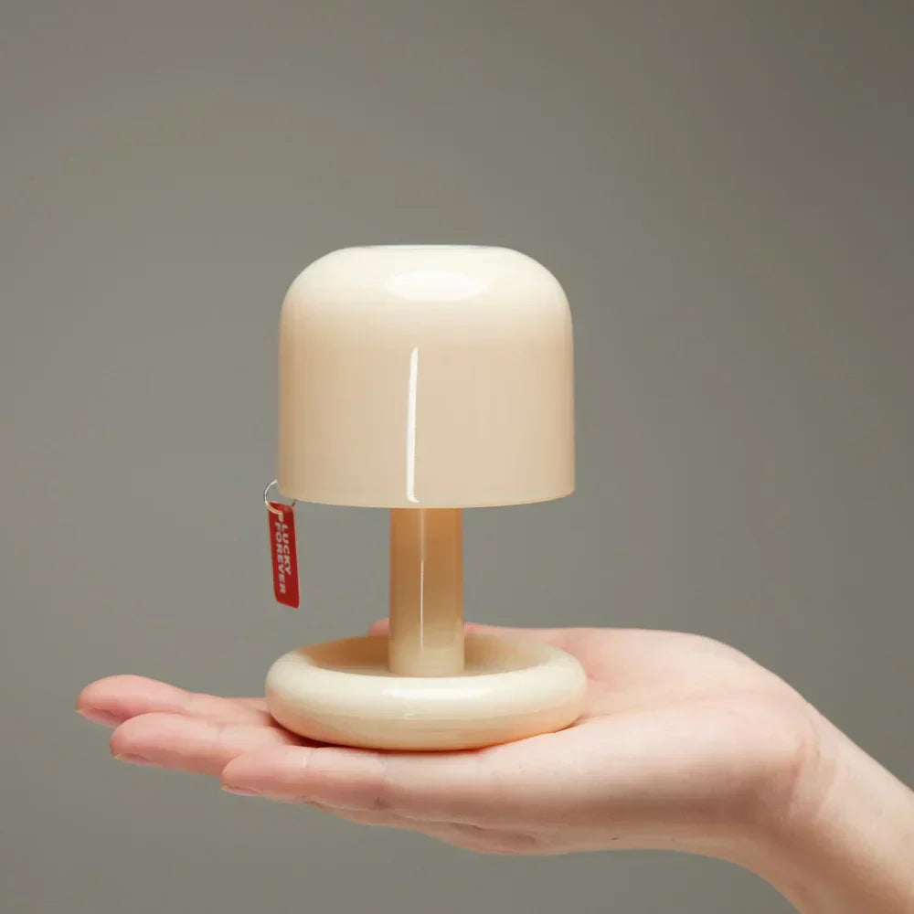Compact LED mini sunset night light projecting a warm golden glow onto a blank wall — view 2