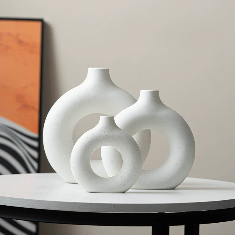 Modern Nordic circle ceramic vase in matte white, minimalist hollow sculptural decor for dried flowers — view 3
