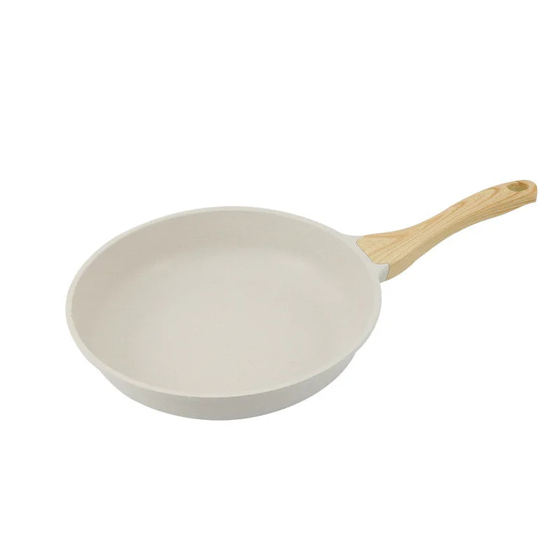 White 28cm non-stick ceramic wok pan with stainless steel handle on modern kitchen counter