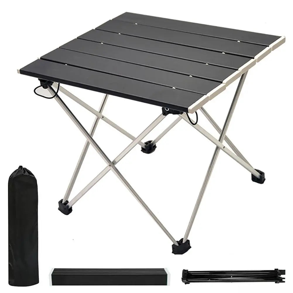 Portable aluminum camping table in silver with black folding bracket and black travel storage bag