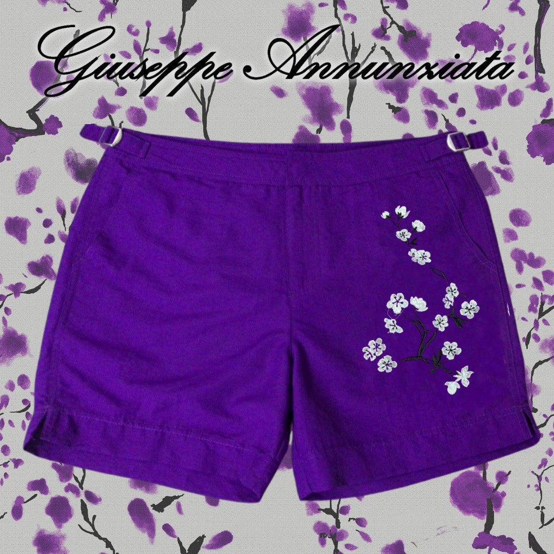 Purple cherry blossom embroidered swim trunks with adjustable drawstring waist and mid-thigh cut