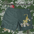 Dark green men's swim trunks with embroidered Japan tiger design, elastic waistband, and adjustable drawstrings.