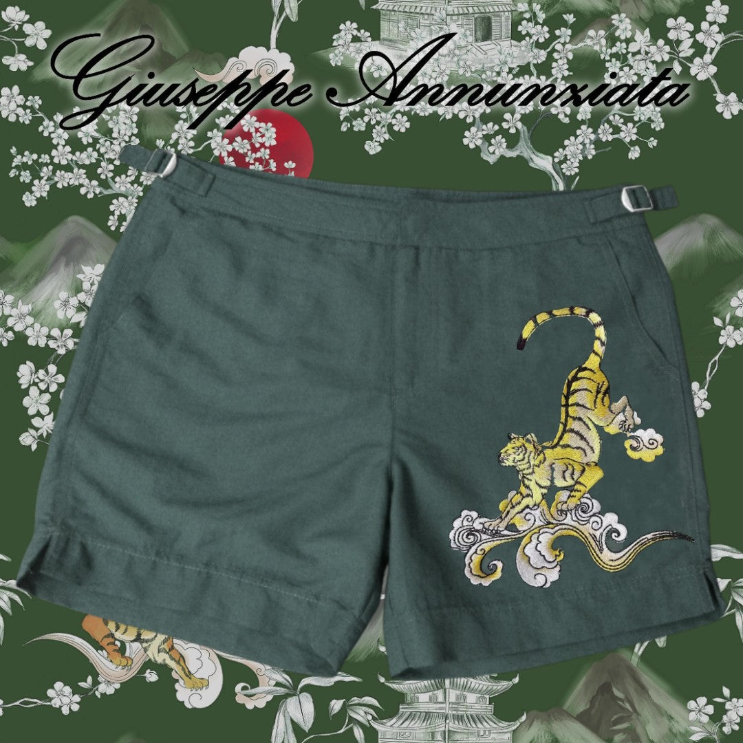 Dark green men's swim trunks with embroidered Japan tiger design, elastic waistband, and adjustable drawstrings.