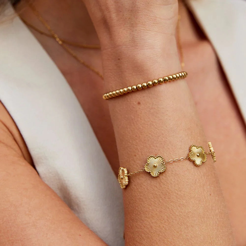 Golden clover flower charm bracelet with a radiant gold finish and delicate adjustable chain — view 4