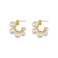 Elegant pearl cluster hoop earrings featuring a polished gold-plated finish and secure clasp design