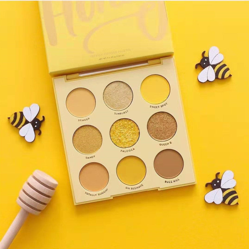 Sparkling honey mineral eye shadow palette featuring shimmering tones in a compact travel-friendly case.
