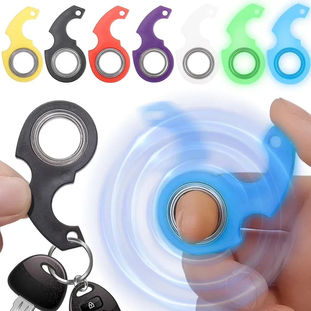 Plastic spinner stress toy keychain fidget ring attached to a metal ring, sensory focus tool — view 3