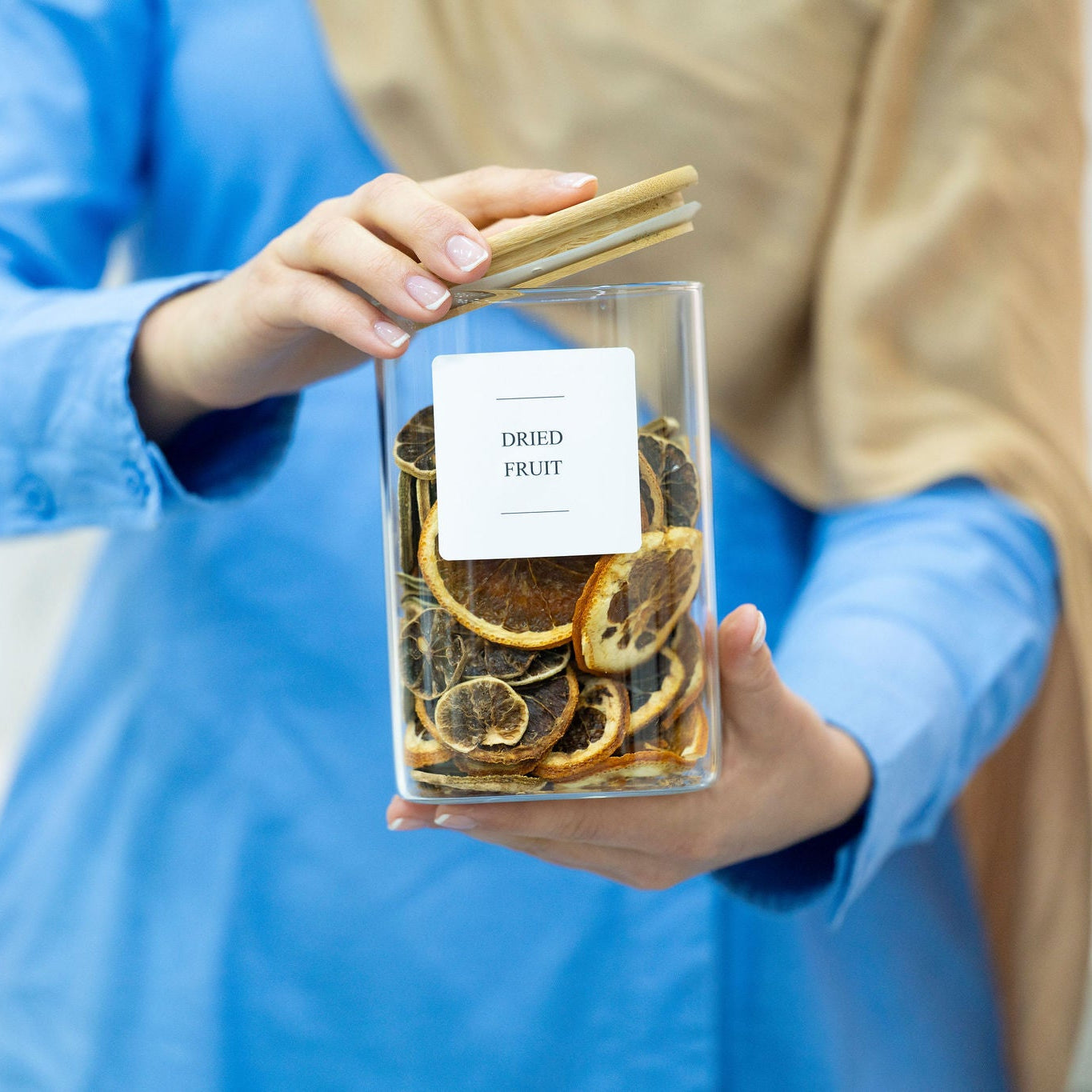 Clear 1100ml square glass jar with an airtight natural bamboo lid for pantry storage