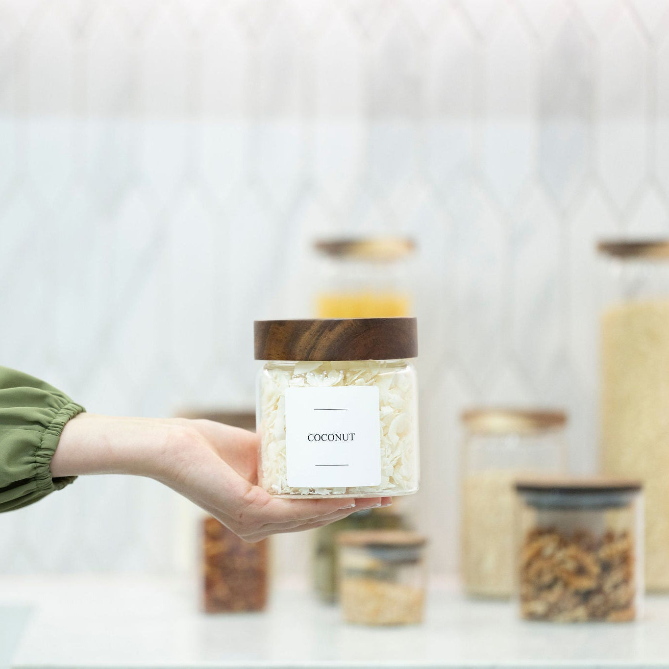 Clear borosilicate glass storage jar with threaded acacia wood screw-on lid for pantry organization — view 5