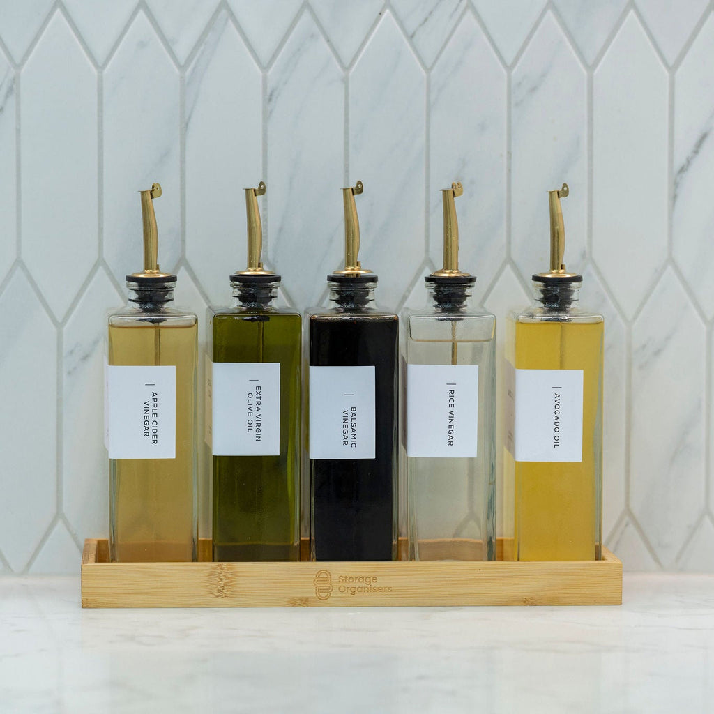 5-piece clear glass oil and vinegar bottle set with precision pourers on a natural bamboo tray — view 3
