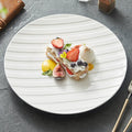 White ceramic plate with diagonal stripe relief texture for elegant modern dining presentations