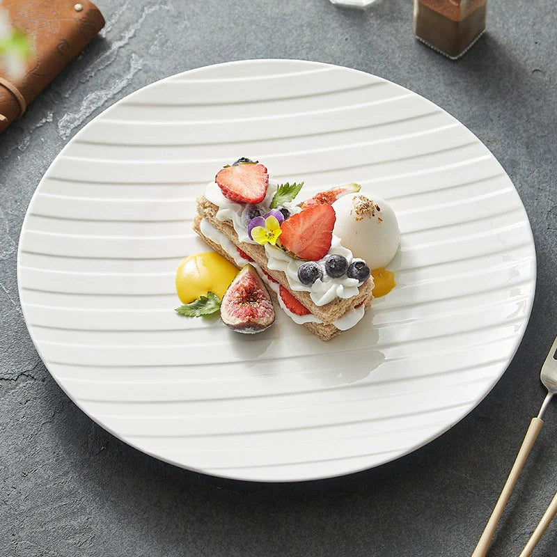 White ceramic plate with diagonal stripe relief texture for elegant modern dining presentations