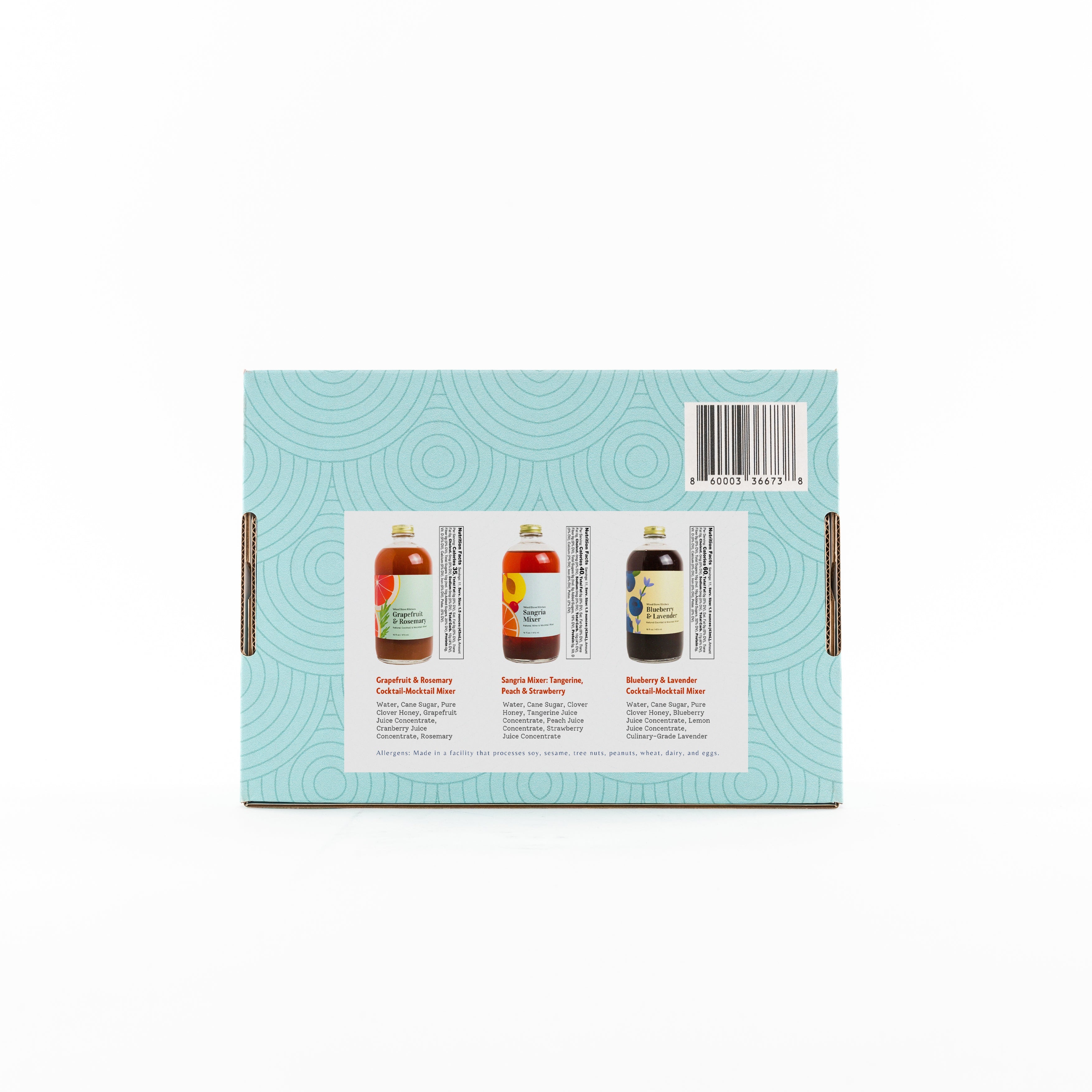 Three bottles of summer cocktail mixers in a gift box featuring sangria and grapefruit flavors — view 3