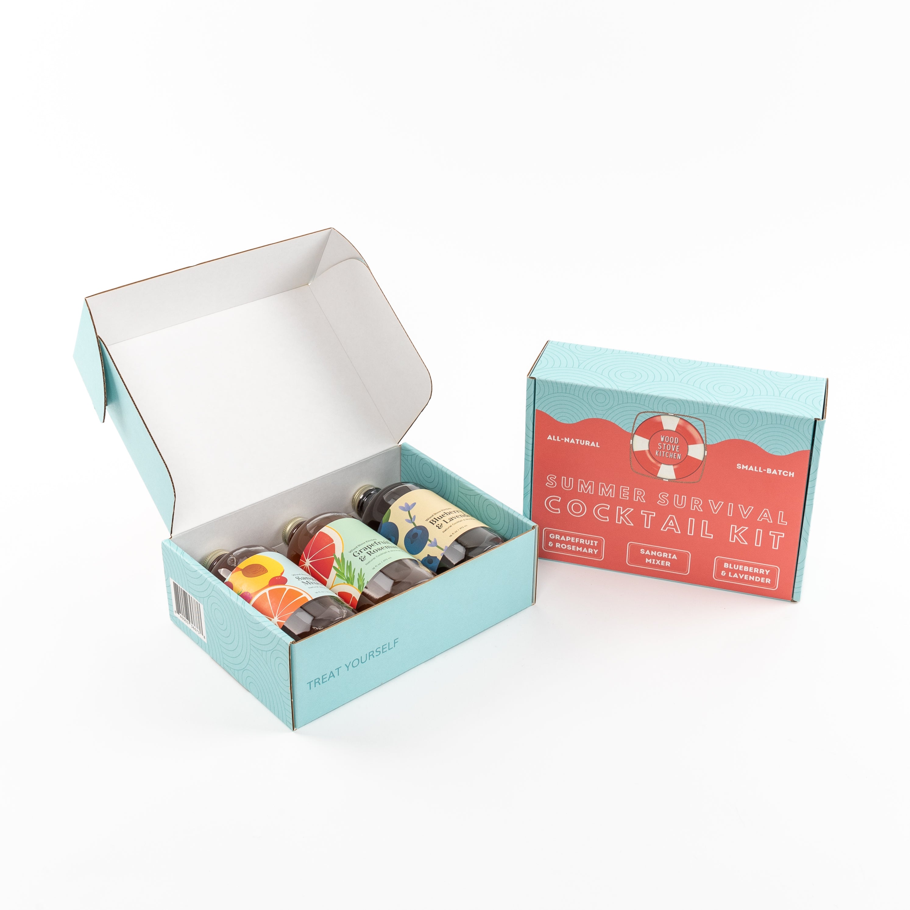 Three bottles of summer cocktail mixers in a gift box featuring sangria and grapefruit flavors
