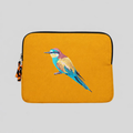 Bee eater laptop sleeve crafted from cotton canvas featuring detailed bird embroidery in earthy colors.