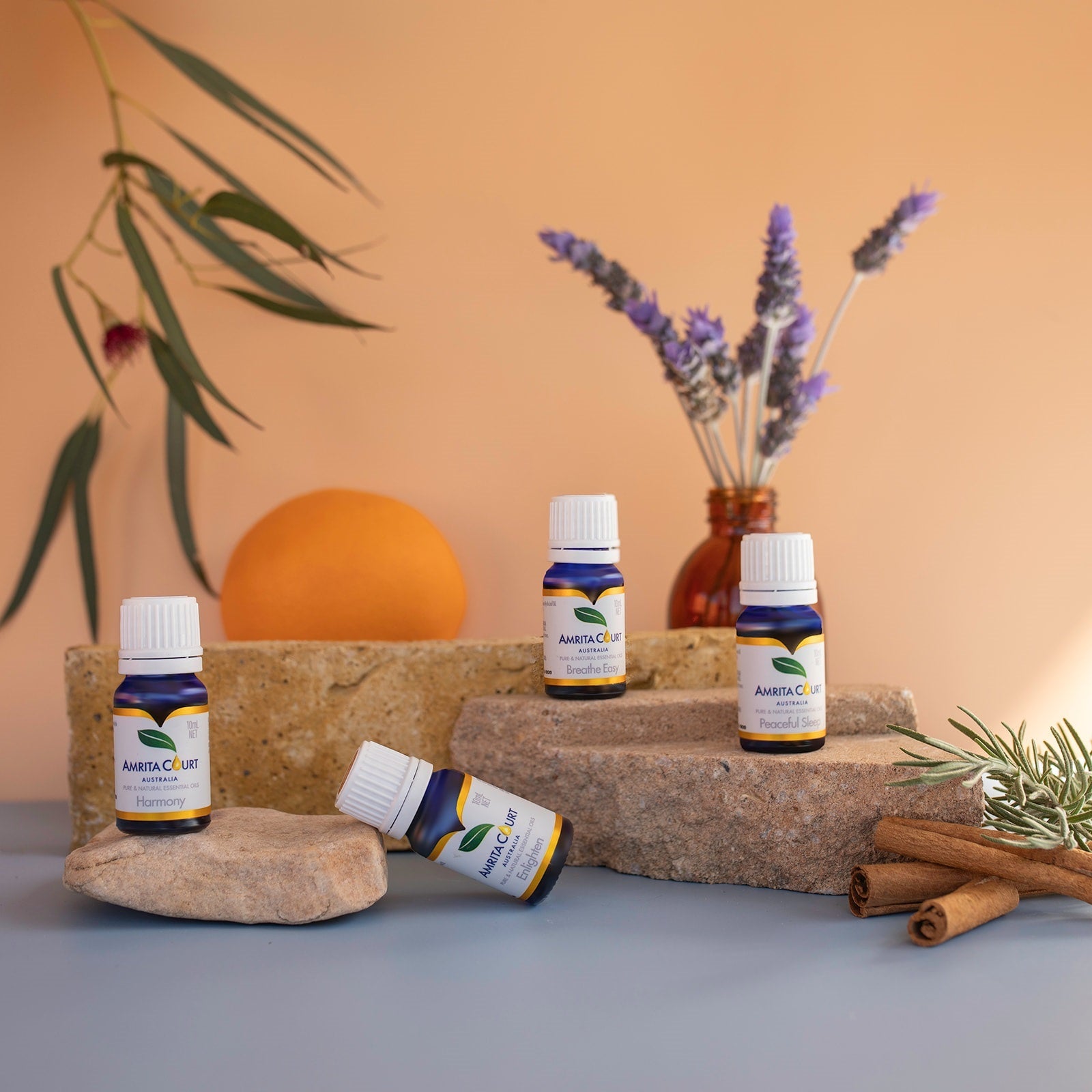 Amrita Court Full Spectrum Ritual Bundle featuring four amber glass essential oil bottles for aromatherapy — view 2