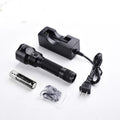 TANK007 PT12 tactical flashlight in black aircraft-grade aluminum showing crenulated bezel and knurled body