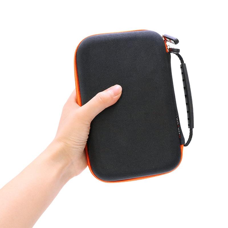 Portable black nylon game console storage bag with zipper and internal mesh card slots — view 3