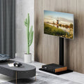 Black metal height adjustable floor TV stand with an AV shelf for flat screens.