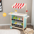 Red wooden kids ice cream cart toy with handle, wheels, chalkboard, and display shelves.