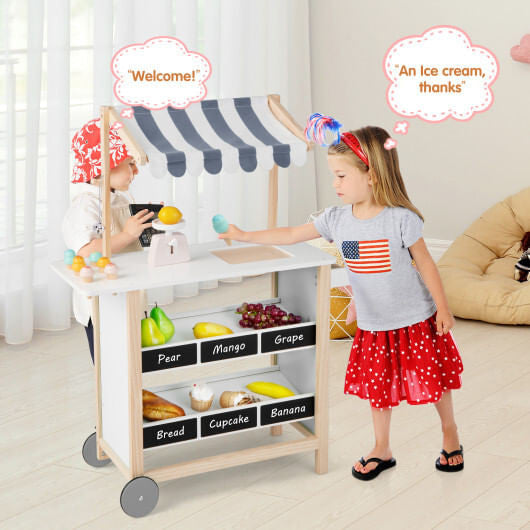 Red wooden kids ice cream cart toy with handle, wheels, chalkboard, and display shelves. — view 7