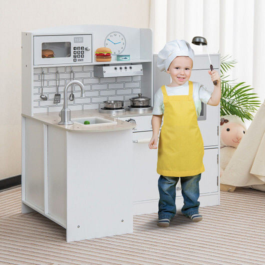 White L-shaped wooden kids kitchen playset with realistic microwave, stove, sink, and refrigerator — view 2