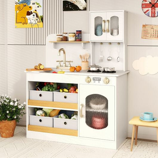 White kids play kitchen set with rotatable faucet, cooking accessories, and cuttable toy vegetables.