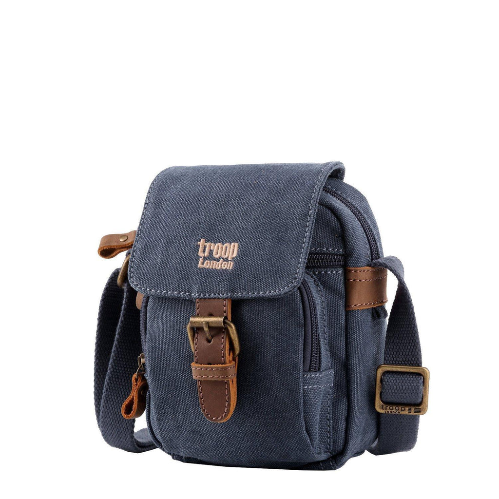 Mini canvas crossbody travel bag with adjustable strap and leather trimmed front buckle detail — view 2