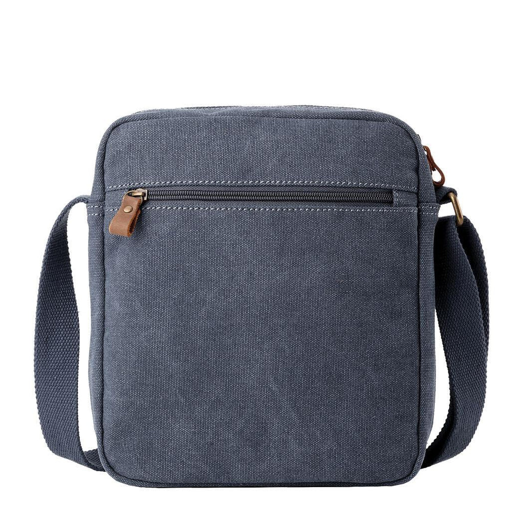 Classic stonewashed canvas crossbody bag with adjustable shoulder strap, brass buckles, and multiple zip pockets. — view 3