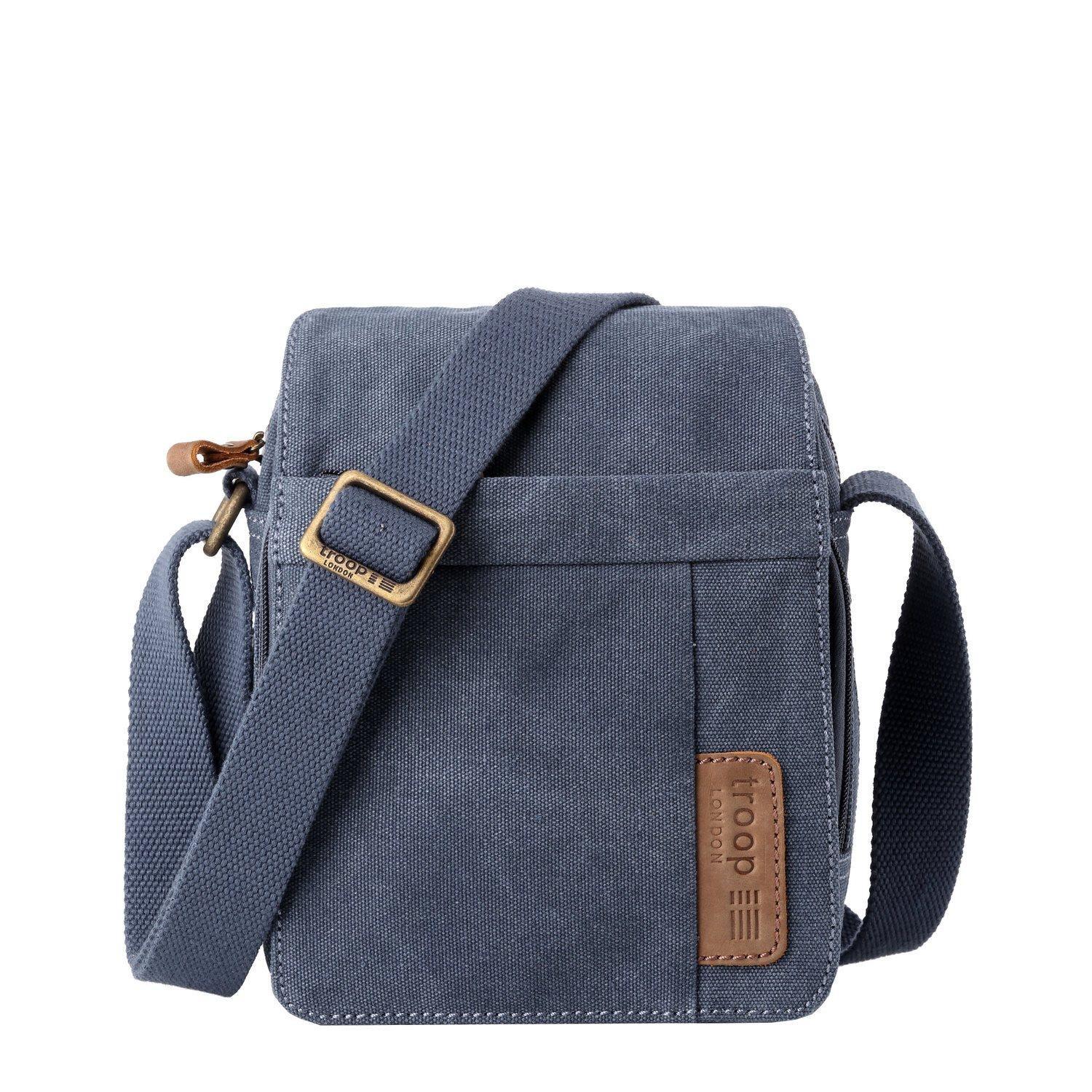 Stonewashed canvas crossbody bag with genuine leather trimmings, brass hardware, and adjustable shoulder strap