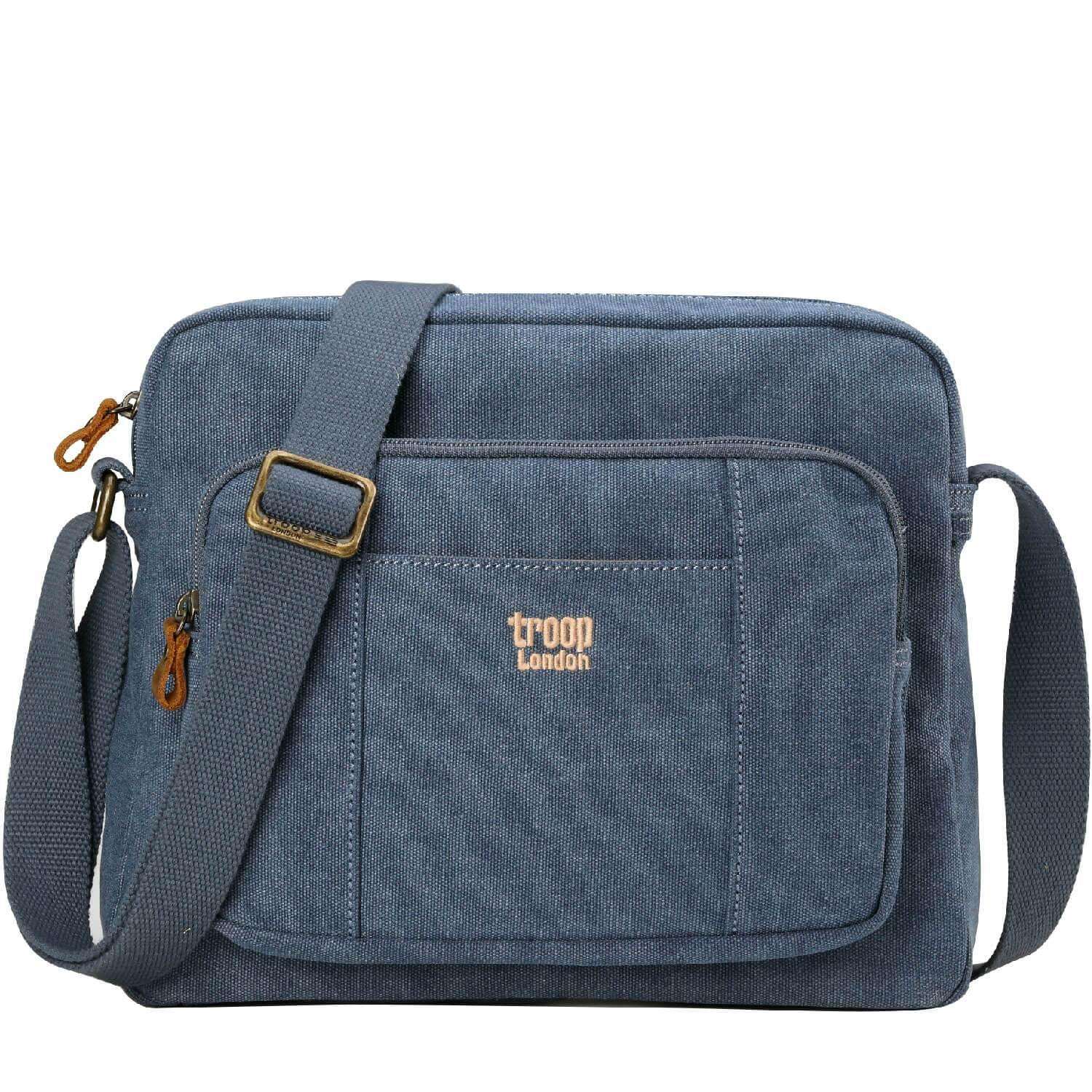 Large stonewashed canvas crossbody bag with adjustable shoulder strap and brass buckles